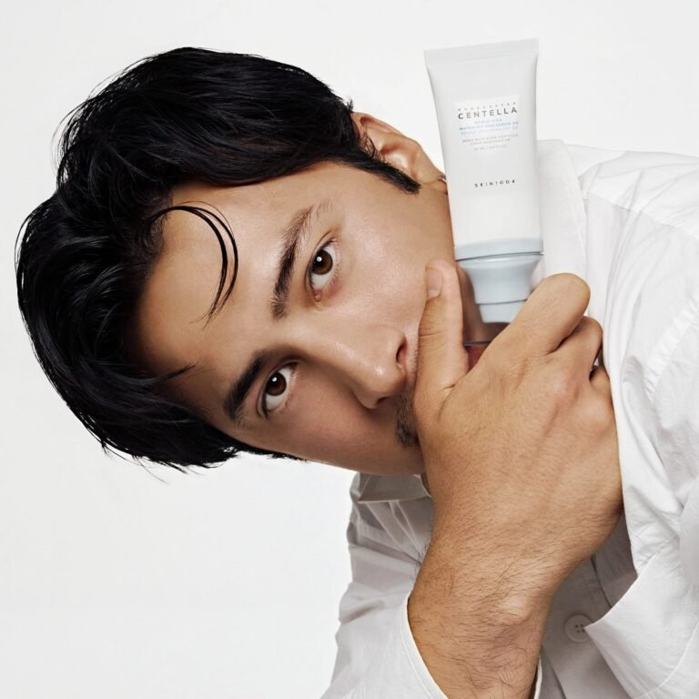 SKIN1004 Hyalu-Cica Water-Fit Sun Serum UV held beside a model's face in the brand's official campaign image